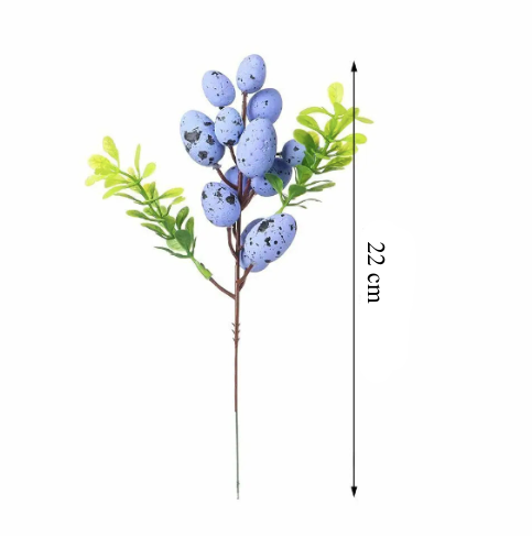 Påskdekoration i grenform med ägg och blommor